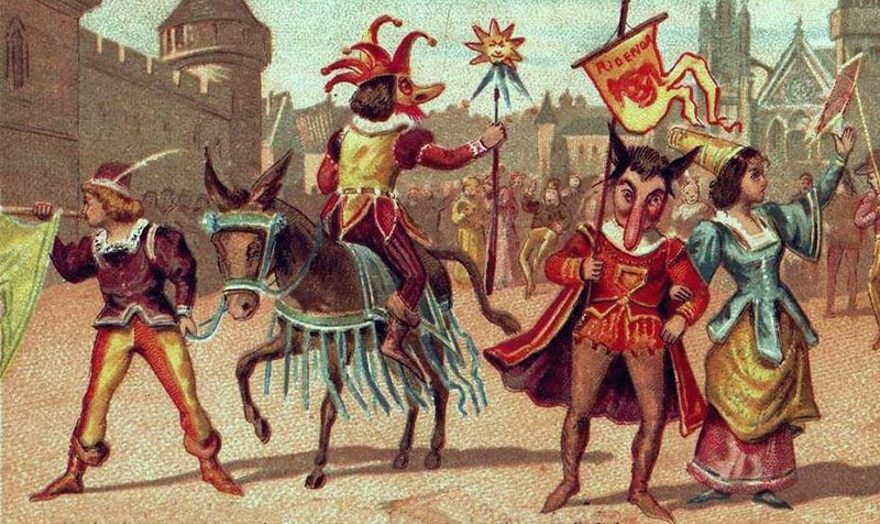 Descrição da imagem: gravura retratando um ambiente de Carnaval, com quatro figuras em primeiro plano, em que as figuras do meio, uma a pé e outra a cavalo, têm os narizes compridos.